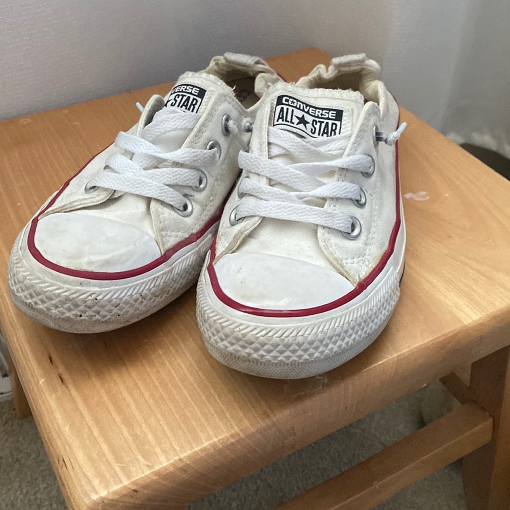 White Converse slip ons